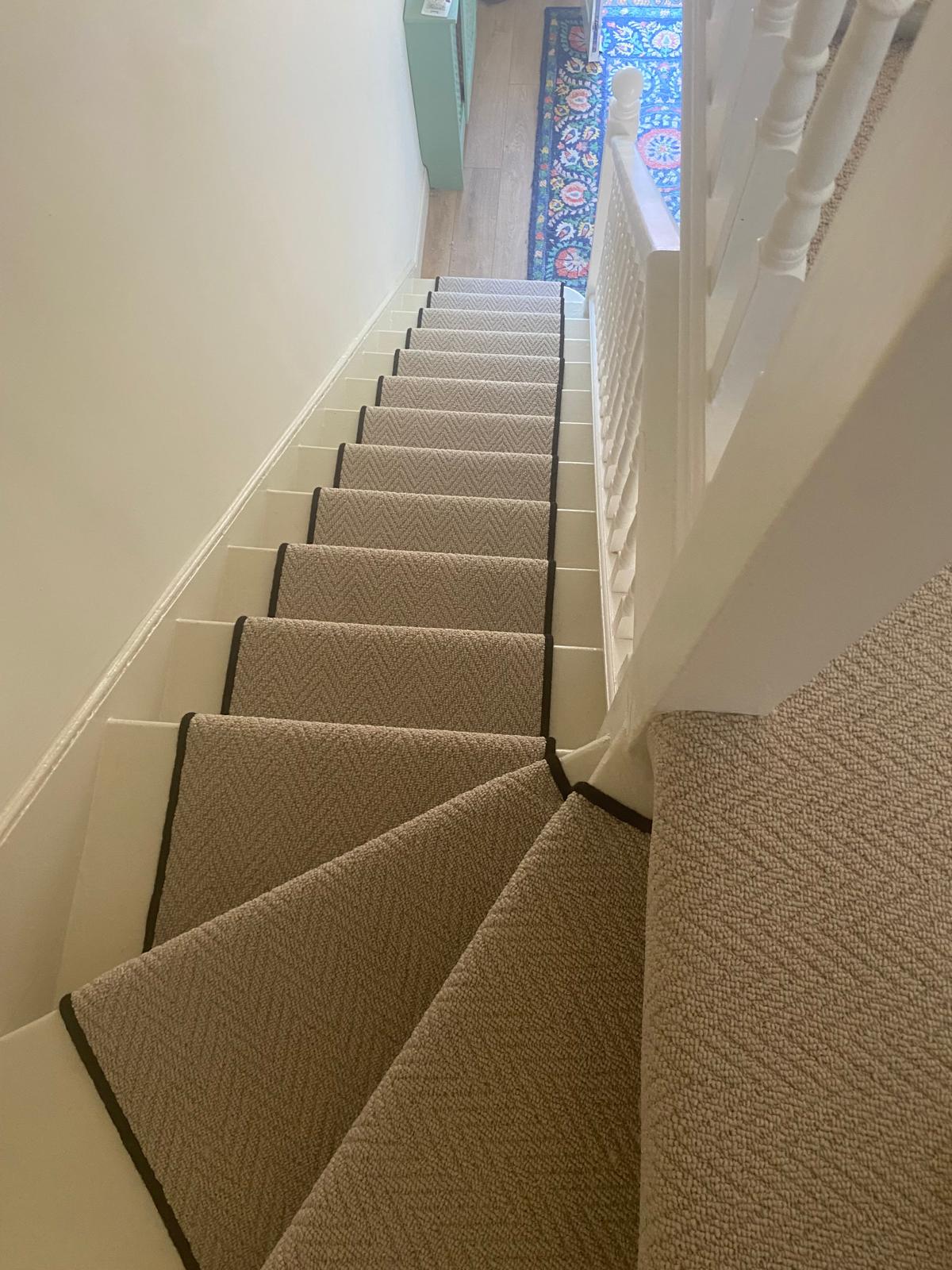 Designer Style Herringbone Latte stair runner looking down a double staircase in Chingford E4 by Carpet World London