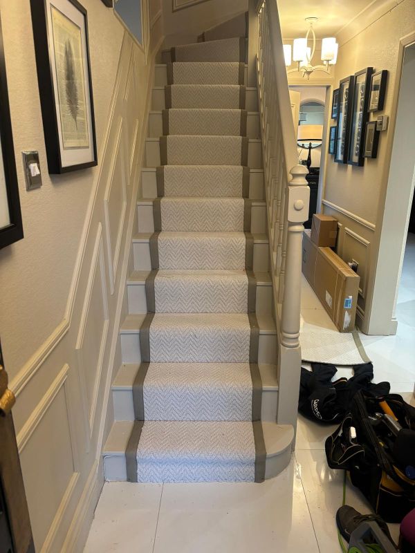 Kellars Herringbone colour Ice fitted as a stair runner with Sage Green linen edging in Bow E3